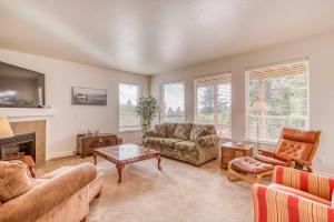 a living room with two couches and a fireplace at Rest Ashore in Netarts