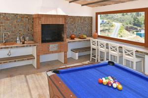 a kitchen with a pool table in a room at Villa Mica in Tijarafe