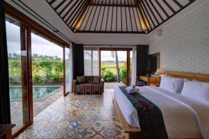 a hotel room with two beds and a large window at Wide Sands Beach Retreat in Pulukan