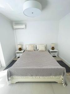 Ένα ή περισσότερα κρεβάτια σε δωμάτιο στο Beach Villa Isidora