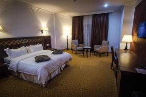 Ένα ή περισσότερα κρεβάτια σε δωμάτιο στο Hotel El Bey Constantine