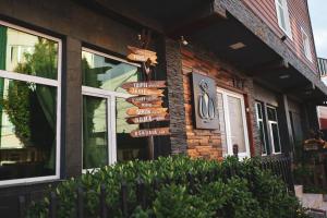 a group of signs on the side of a building at Oshovia Hostel in Ushuaia