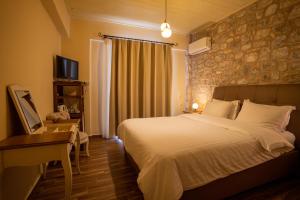 Ένα ή περισσότερα κρεβάτια σε δωμάτιο στο Guesthouse Laoula
