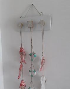 a group of four glass ornaments hanging on a wall at Casa in SALENTO a Otranto in Otranto