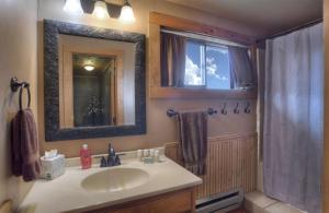 a bathroom with a sink and a shower with a window at Stapp Mountain Retreat in South Fork, CO in South Fork +38 photos
