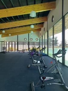 a gym with several exercise bikes in a room at Departamento con vista al mar en Condominio Lagunamar in Las Cruces