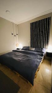 a bedroom with a large bed in a room at Entire apartment in Al Ahsa
