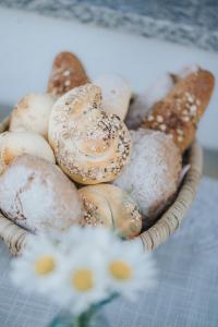 a basket of donuts and pastries on a table at Titscherhof in Leutschach