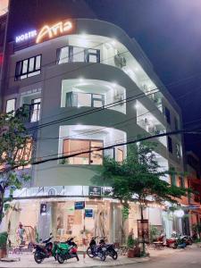 a building with three motorcycles parked in front of it at HOSTEL ARIA in Quy Nhon +16 photos