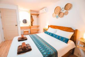 Ein Bett oder Betten in einem Zimmer der Unterkunft Leeloo Paradise