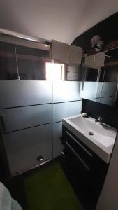 a small bathroom with a sink and a mirror at Casa Francesca in Saint-Florent +39 photos