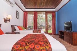 Voodi või voodid majutusasutuse Nandel Beach Resort toas