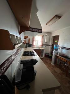 A kitchen or kitchenette at Chalet en La Barrosa, Piscina+BBQ+Grifo de Cerveza
