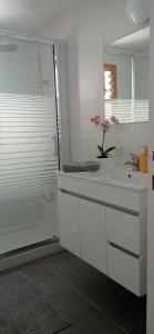 a white bathroom with a sink and a shower at HC home abroad Costa Adeje in Adeje