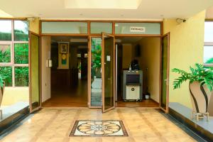 an entrance to a building with an open door at Kim Hotel in Kigali