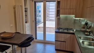 A kitchen or kitchenette at Dudi Apartment