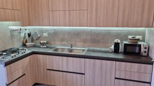 A kitchen or kitchenette at Dudi Apartment