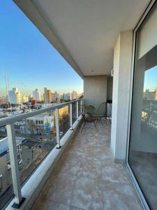 a balcony of a building with a view of a city at Depto moderno y luminoso La Plata zona céntrica in La Plata