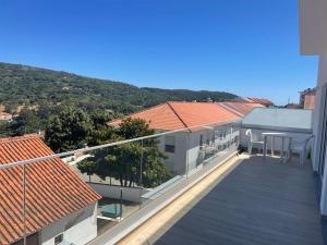 a balcony of a building with red roofs at Alojamento S. Gabriel 1 in Monchique