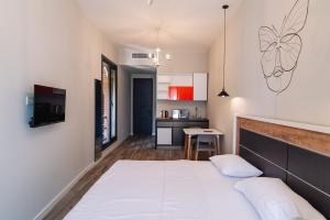 Postel nebo postele na pokoji v ubytování Wine Rock Hotel