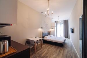 Postel nebo postele na pokoji v ubytování Wine Rock Hotel