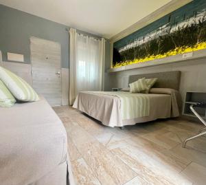 Postel nebo postele na pokoji v ubytování Hostal Noli