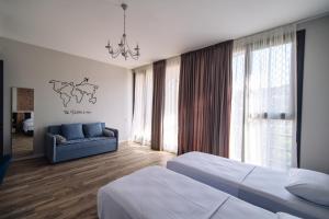 Postel nebo postele na pokoji v ubytování Wine Rock Hotel