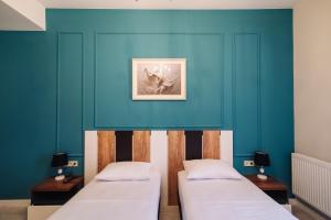 Postel nebo postele na pokoji v ubytování Wine Rock Hotel