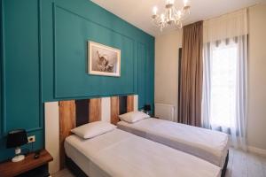Postel nebo postele na pokoji v ubytování Wine Rock Hotel