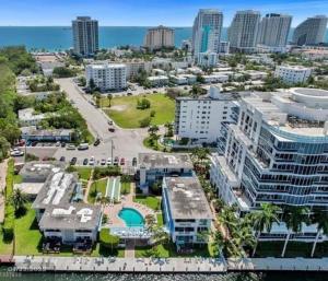 an aerial view of a city with buildings and the ocean at FortLauderdale Beach Apartment in Fort Lauderdale