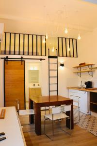 a room with a desk and a loft bed at Mas Thomasine Séjour Romantique au calme in Peillon