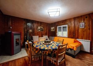a living room with a table with a cake on it at Stairway - Vučje in Nikšić