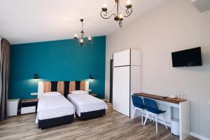 Postel nebo postele na pokoji v ubytování Wine Rock Hotel