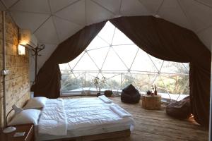 Voodi või voodid majutusasutuse Elsesi Racha Glamping toas