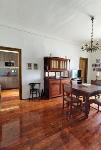 a living room with a table and a kitchen at Apartment Emma in Preko +9 photos