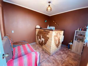 a room with a wooden bar in the corner at Hostal Katari in San Pedro de Atacama