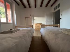 Łóżko lub łóżka w pokoju w obiekcie Gîte tout confort en Cévennes 3 étoiles