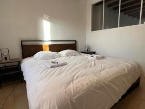 Łóżko lub łóżka w pokoju w obiekcie Gîte tout confort en Cévennes 3 étoiles