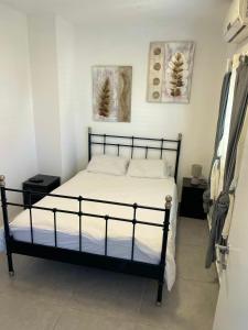 a bedroom with a bed in a room at GK apartment Harmony in Bat Yam