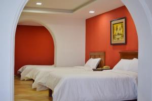 Letto o letti in una camera di Hotel Ambassador