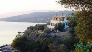 a house on an island in the water at Sea Front in Milina