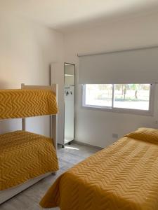 Двухъярусная кровать или двухъярусные кровати в номере Casa del Valle Merlo