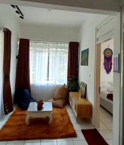Postel nebo postele na pokoji v ubytování Villa Kebun Prambanan