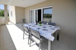 a dining room with a table and some chairs at Apartments with a parking space Plano, Trogir - 11649 in Trogir