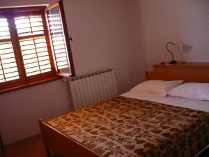Posteľ alebo postele v izbe v ubytovaní Apartments by the sea Umag - 11647