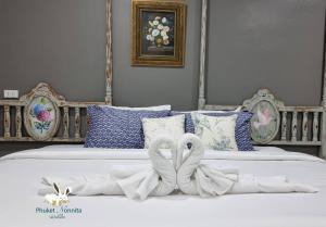 Postel nebo postele na pokoji v ubytování Phuket Nonnita Boutique Resort - SHA Plus