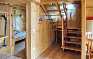 a room with a bunk bed and a ladder at Amazing Home In Kopalino With 3 Bedrooms in Kopalino