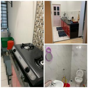 a bathroom with a sink and a toilet in it at Apartment Uno teratak kasih in Sandakan