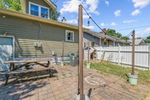 a backyard with a picnic table and a house at RENU at ICT St Claire House in Wichita