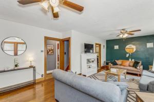 a living room with a couch and a ceiling fan at RENU at ICT St Claire House in Wichita